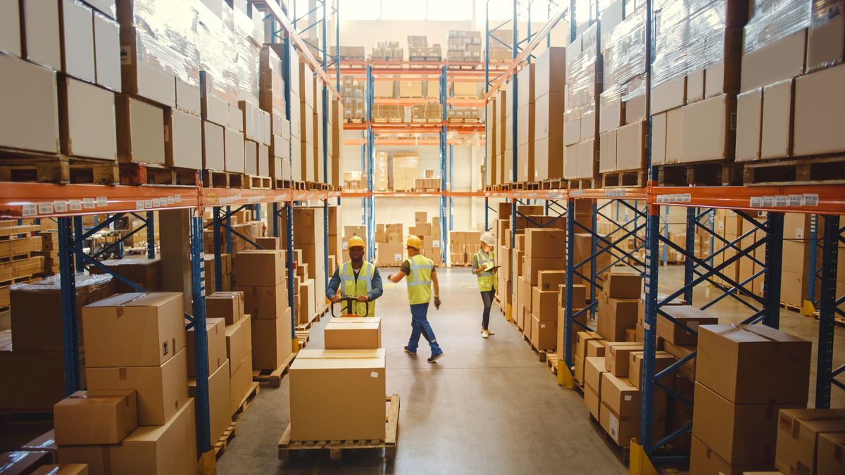 Warehouse workers moving boxes